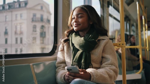 Young african woman traveling with tram during winter season - City, transportation and urban lifestyle concept - Models by AI generative