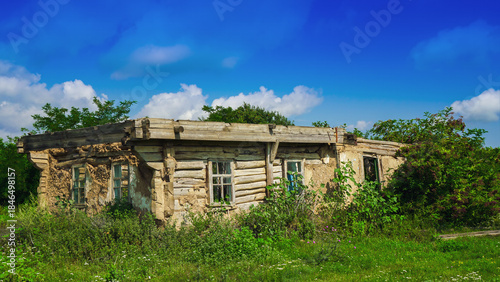 Abandoned Wooden House Ruins Overgrown by Nature