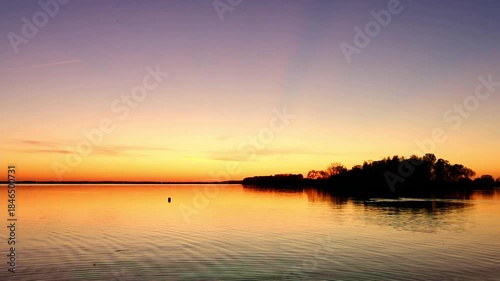 Beauty in nature. Sunset landscape with water sea, islands, Calm weather. Orange dusk sky. High quality 4K.