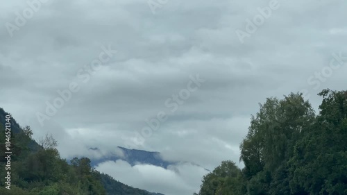 Driving Through Cloudy Mountain Valley