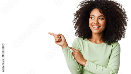Smiling woman pointing to the side wearing green shirt isolated on a transparent background