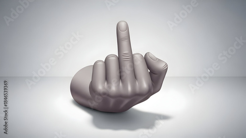 Grey sculpture of hand giving middle finger gesture.