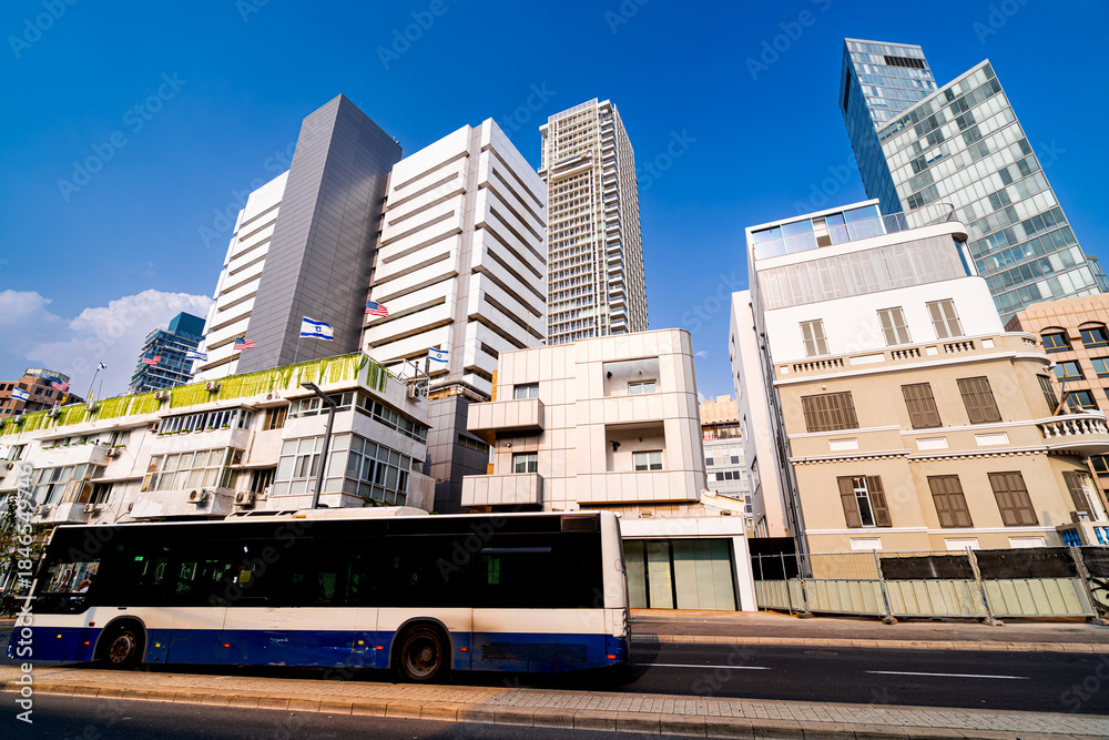 Obraz premium Morning traffic in Tel Aviv with office buildings, Israel. Life in city in the Middle East.