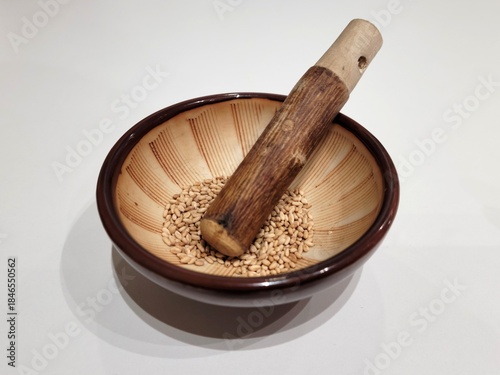 Sesame Seeds or Perilla Seeds in Traditional Korean Ceramic Bowl and Mortar