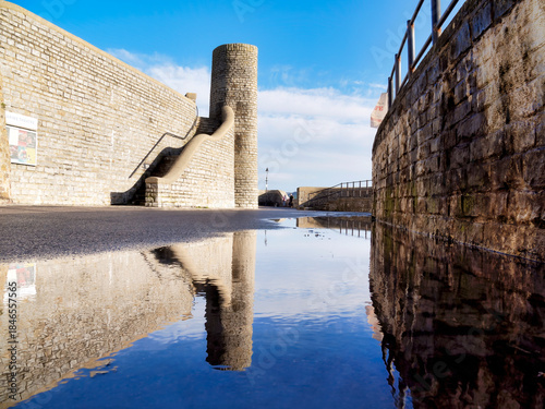 Puddle Reflections along Gun Cliff Walkway in Winter at Lyme Regis Dorset