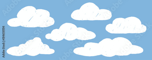 Hand drawn cloud set on blue background with chalk texture