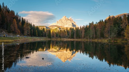 Lago d Antorno with Tre Cime Peak and autumn larch forest reflection during sunset in Dolomites, Italy