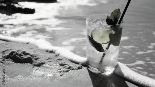 A minty beverage with ice and a straw, perfect for summer days at the beach.