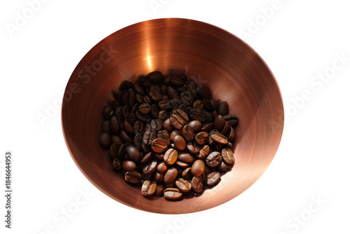Copper bowl with coffee beans.