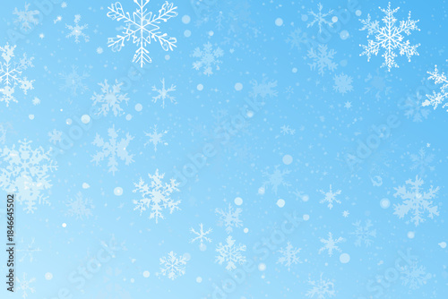 A serene blue background with delicate white snowflakes falling gently