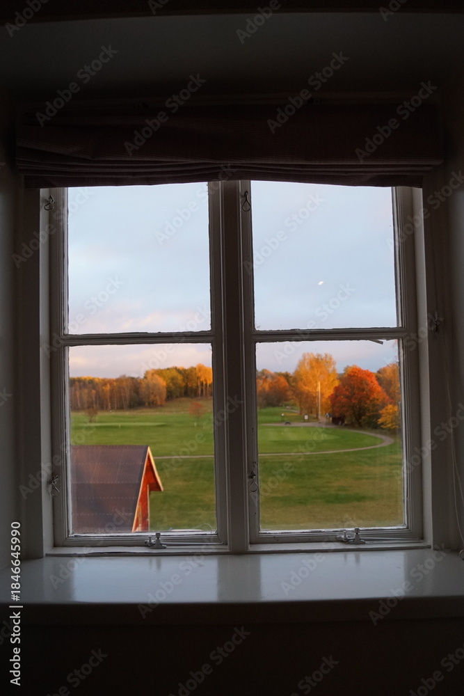 Fototapeta premium Stunning autumn vibes with orange and yellow trees in the Swedish countryside around Sörmland