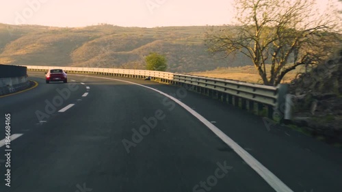 Smooth Highway Road with Guardrail in Scenic Landscape