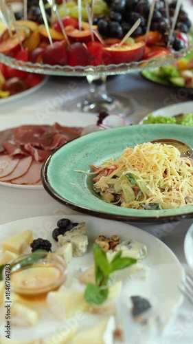A wide variety of food and dishes on the bride and groom's festive table. A wedding banquet for the birthday and gala evening events.