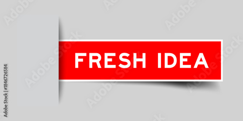 Red color square shape sticker label with word fresh idea inserted in gray background