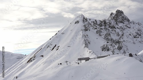 Ski lift station on snowy mountain peak