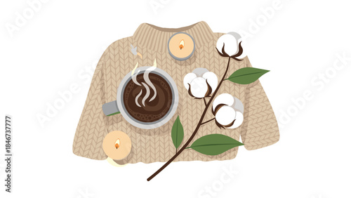 Cozy autumn still life featuring a warm beverage, lit candles, and a cotton branch on a knitted sweater.
