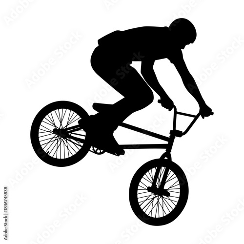 Extreme BMX Bicycle Rider Performing Aerial Silhouette Jump.