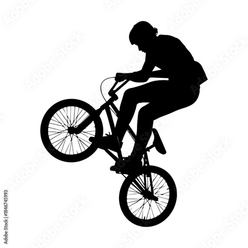 Extreme BMX Bicycle Rider Performing Aerial Silhouette Trick.