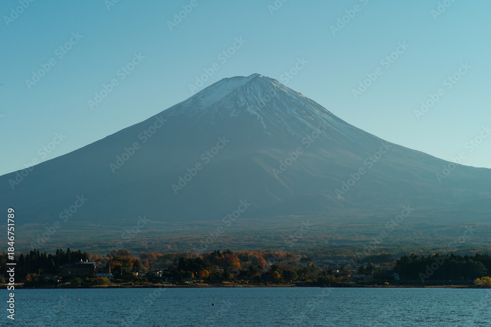 Fototapeta premium Panorama view of Fuji mountain isolated on the blue sky with lake in foreground