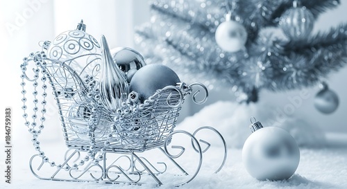 Elegant silver christmas sleigh filled with festive ornaments against a snowy background