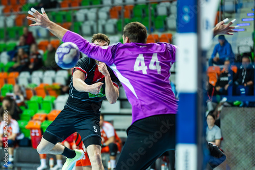 player throws ball next to the goalkeeper during handball match