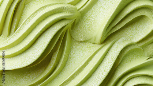 Close-up view of a matcha ice cream swirl, showcasing its smooth texture and vibrant green color. The perfect visual for food enthusiasts 