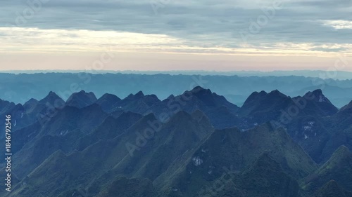Layered Silhouettes of Karst Mountains at Dawn in Qibainong National Geopark Guangxi China