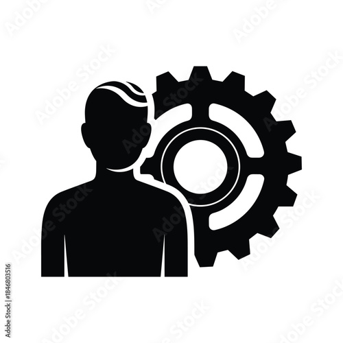 Black silhouette of a person next to a large gear wheel male