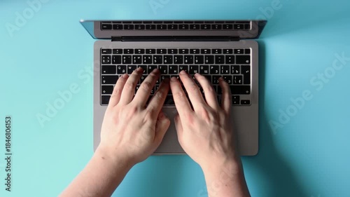 Hands Typing on Laptop Keyboard