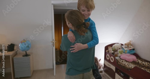 Man Hugs Child in Room at Home. 4K 10-bit