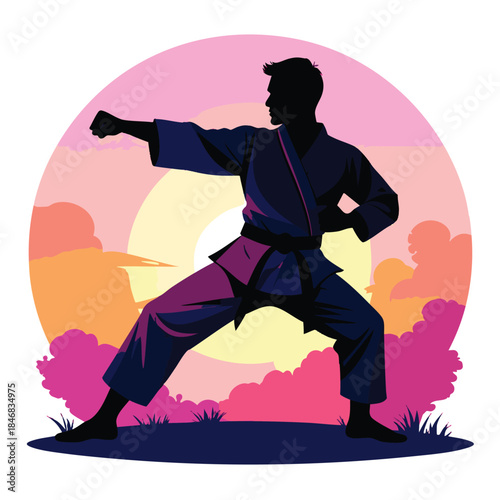Silhouette of a man practicing karate in a fighting stance outdoors at sunset