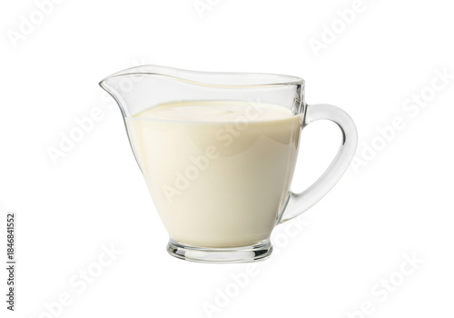 pristine glass creamer jug filled with pale yellow heavy dairy cream, hyper-sharp focus, minimalist composition on a high-key white background with copy space. concept for premium dairy advertising