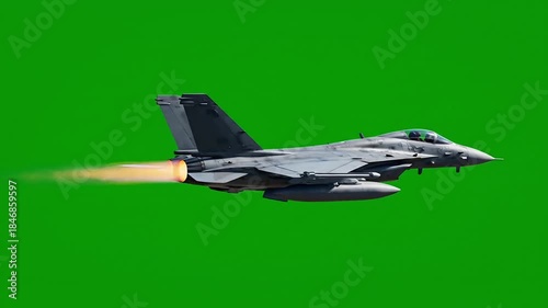 Military jet flying through clear green skies with pilot on board