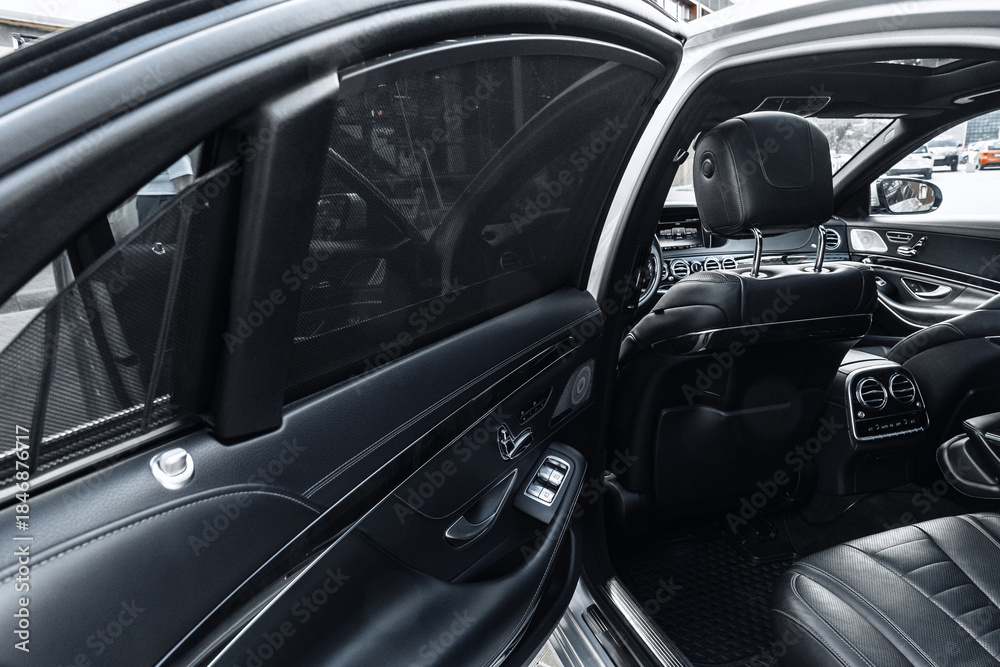 Fototapeta premium Luxury car interior with sleek design and privacy features at a city location