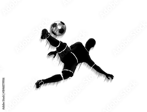 A silhouette of a soccer player kicking in an acrobatic position 