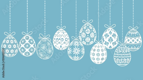 A row of white decorative Easter eggs with intricate patterns hanging against a light blue background, celebrating spring and holidays.