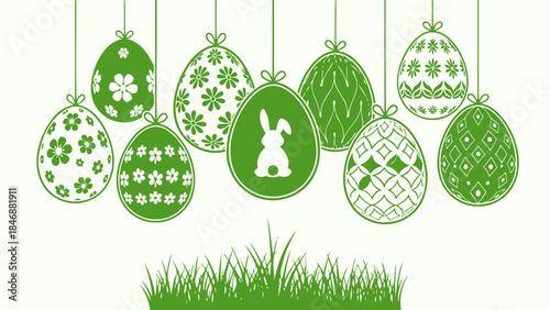 Green Easter eggs with patterns and a bunny hanging above grass, symbolizing spring and holiday celebrations.