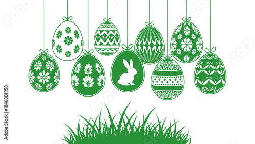 Green Easter eggs with patterns and a bunny hanging above grass