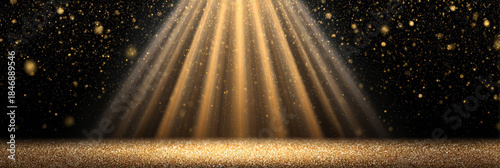 Brilliant gold spotlight with light beams shining down on an empty stage. dark background has sparkling glitter, perfect for an award ceremony or glamorous presentation