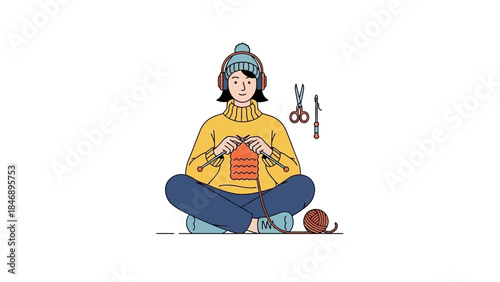 Woman sitting comfortably knitting with yarn and headphones on