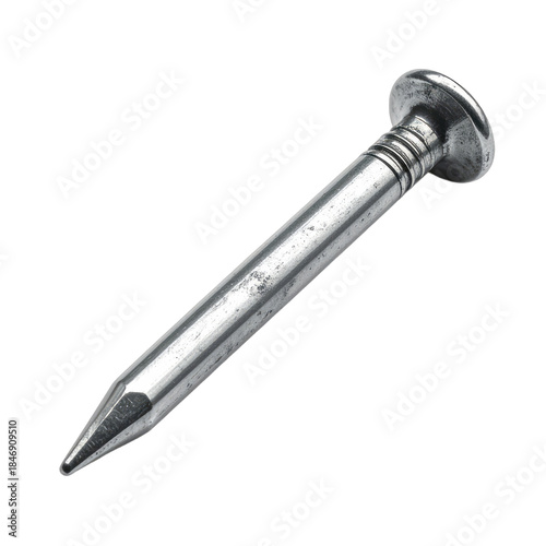 A single, metallic finishing nail is isolated against a stark black background.