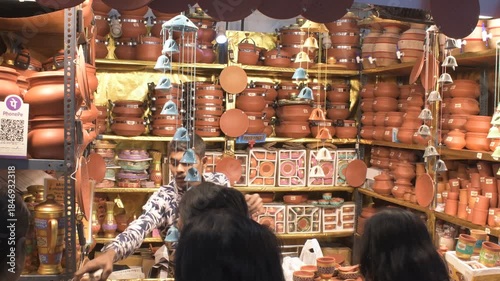busy terracotta pottery and clay utensils stall during india international mega trade fair