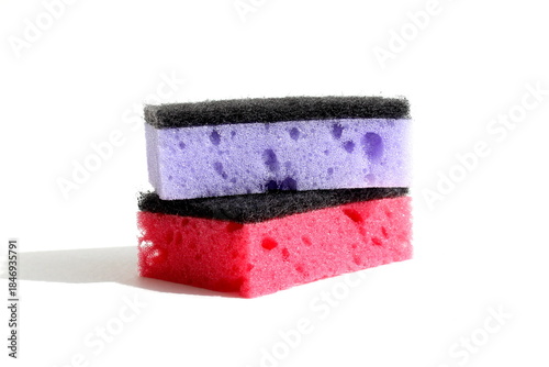 Bild auf Leinwand Several soft porous sponges lie on a white background.