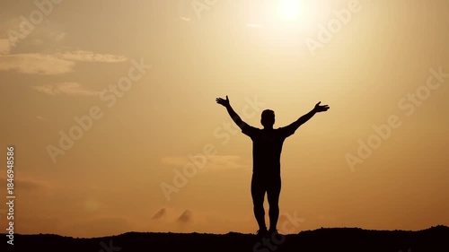 Wallpaper Mural A silhouetted person is enjoying the freedom of raising hands toward the sun Torontodigital.ca
