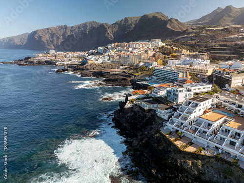 Aerial view of rocky coast Los Gigantes. Panorama the city of Puerto de Santiago and Los Gigantes, Tenerife, Canary Islands, Spain.