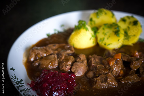 ready to eat - goulash from venison with potatoes and cranberry jam
