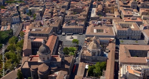 Aerial view of streets, rooftops, houses and buildings in the historic center of Catania, Sicily, Italy. It's a beautiful, sunny summer day.