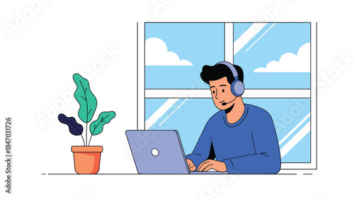 Young man wearing a headset works on his laptop by a window, representing a call center agent, remote work, or online support.