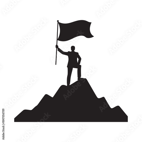 Silhouette of a man triumphantly waving a flag atop a mountain peak