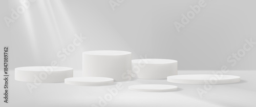 White circular podiums of various heights placed on a soft gray background with light beams, minimal style, concept of product display. Vector illustration